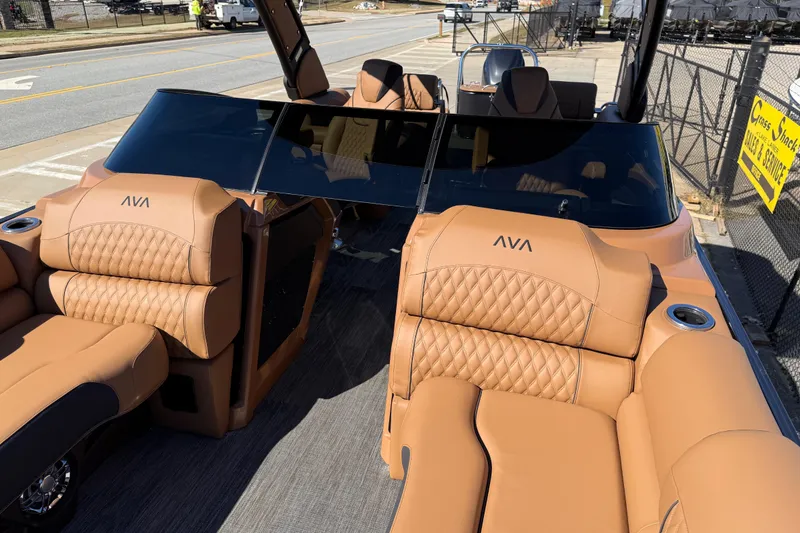Slide: The Image of 2026 Avalon Catalina Quad Lounger Windshield with luxurious tan seating and sleek design. - 25