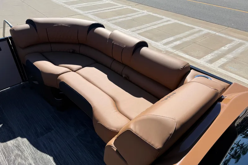 Slide: The Image of Luxurious seating on 2026 Avalon Catalina Quad Lounger Windshield boat, featuring tan upholstery. - 27
