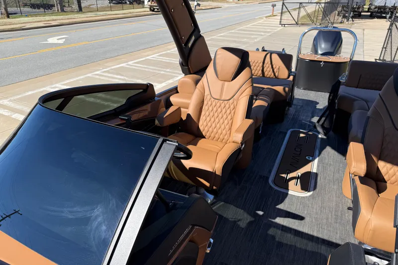 Slide: The Image of 2026 Avalon Catalina Quad Lounger Windshield with luxurious tan seating and sleek design. - 30