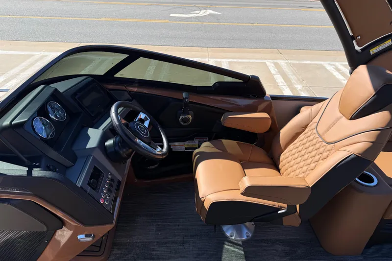 Slide: The Image of 2026 Avalon Catalina Quad Lounger Windshield interior with luxurious tan seating and modern dashboard. - 32