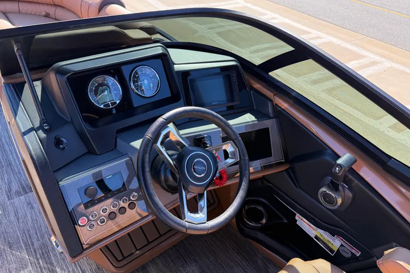 Slide: The Image of 2026 Avalon Catalina Quad Lounger Windshield dashboard with steering wheel and controls. - 33