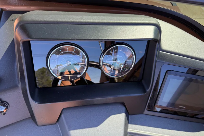 Slide: The Image of Dashboard of 2026 Avalon Catalina Quad Lounger Windshield with gauges and Garmin display. - 35