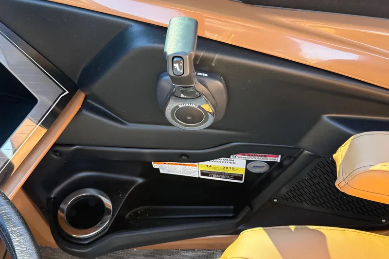 Slide: The Image of 2026 Avalon Catalina Quad Lounger Windshield interior with control panel and cup holder. - 40