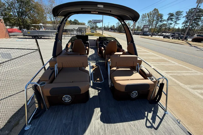 Slide: The Image of 2026 Avalon Catalina Quad Lounger Windshield boat with luxurious seating and modern design. - 57