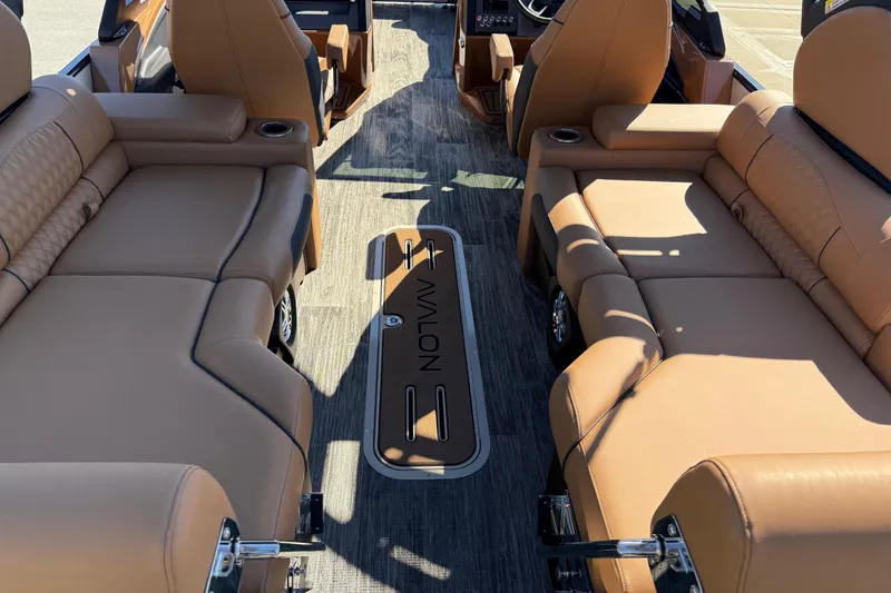 Slide: The Image of 2026 Avalon Catalina Quad Lounger Windshield interior with luxurious tan seating and modern design. - 62