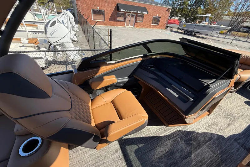 Slide: The Image of 2026 Avalon Catalina Quad Lounger Windshield with luxurious tan seating and modern dashboard. - 69