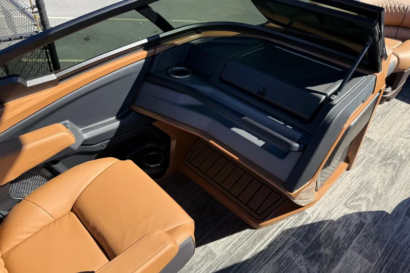 Slide: The Image of 2026 Avalon Catalina Quad Lounger Windshield interior with tan seating and sleek design. - 70