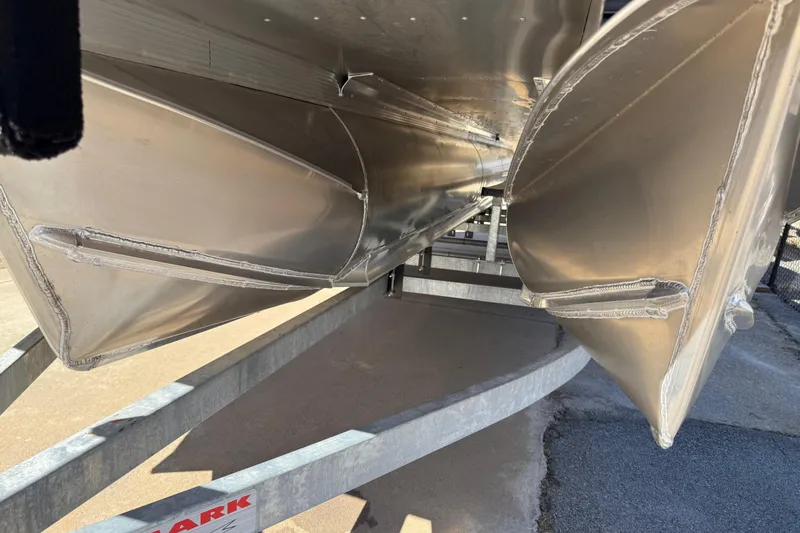 Slide: The Image of 2026 Avalon Catalina Quad Lounger Windshield pontoon boat on trailer, close-up view. - 77