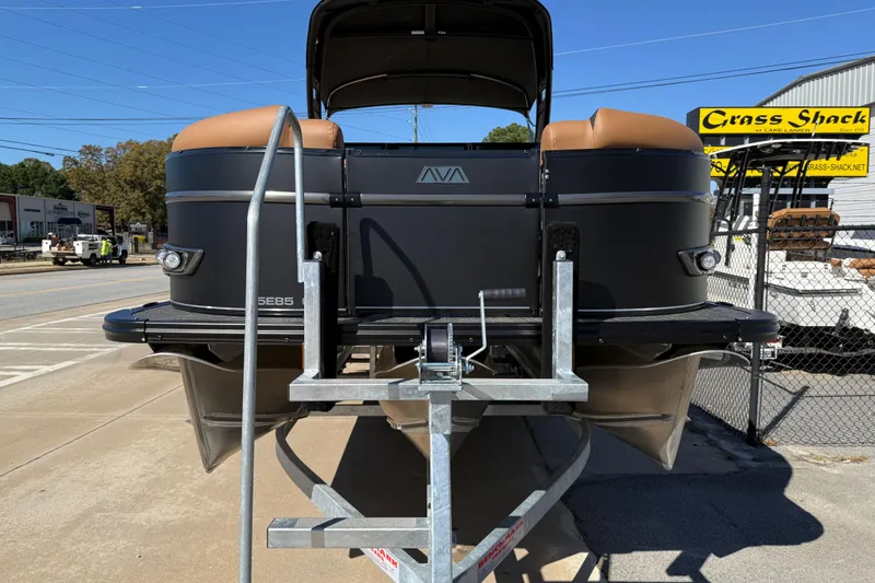Slide: The Image of 2026 Avalon Catalina Quad Lounger Windshield boat on trailer at dealership. - 9
