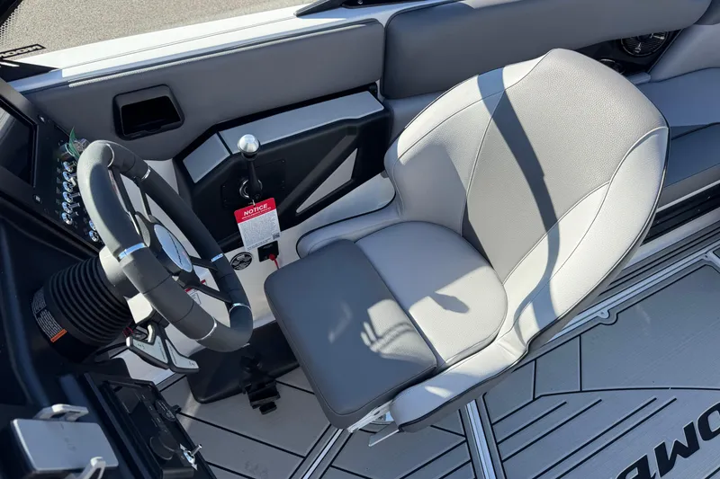 Slide: The Image of 2026 Moomba Craz boat interior with steering wheel and captain's seat. - 10