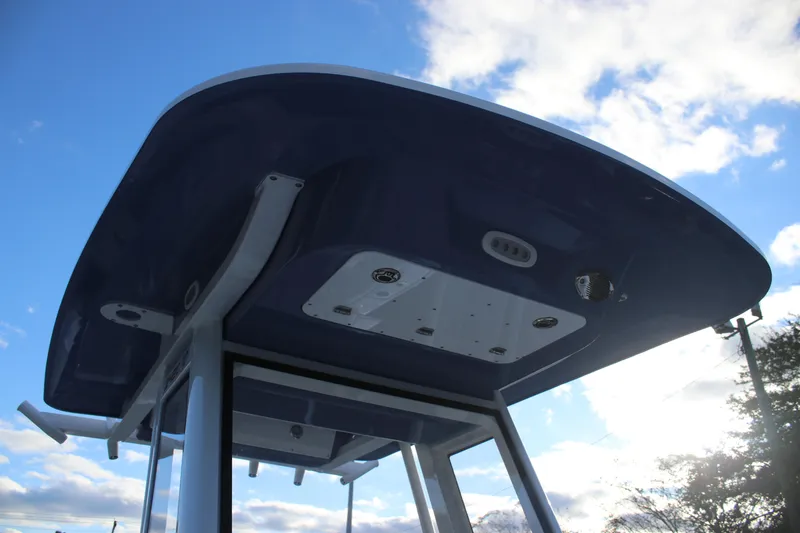 Slide: The Image of Rooftop view of 2026 Sea Fox 248 Commander boat against a blue sky. - 12