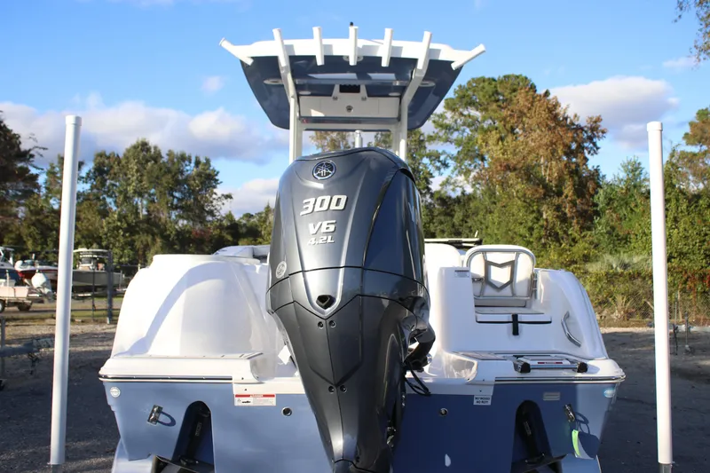 Slide: The Image of 2026 Sea Fox 248 Commander boat with Yamaha 300 V6 engine, outdoor setting. - 14