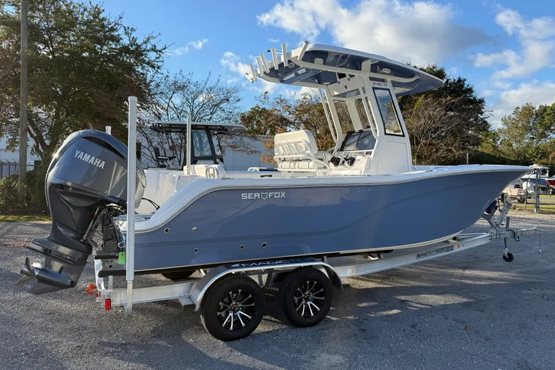 Slide: The Image of 2026 Sea Fox 248 Commander boat on trailer with Yamaha engine, parked outdoors. - 3