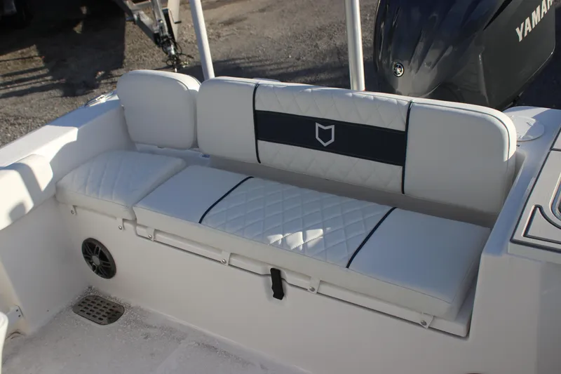 Slide: The Image of 2026 Sea Fox 248 Commander boat seating with quilted cushions and Yamaha engine. - 7