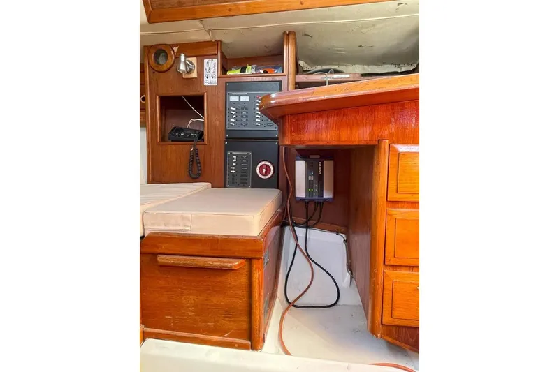 Slide: The Image of Interior of 1986 Ericson 381 sailboat with navigation equipment and wooden cabinetry. - 16