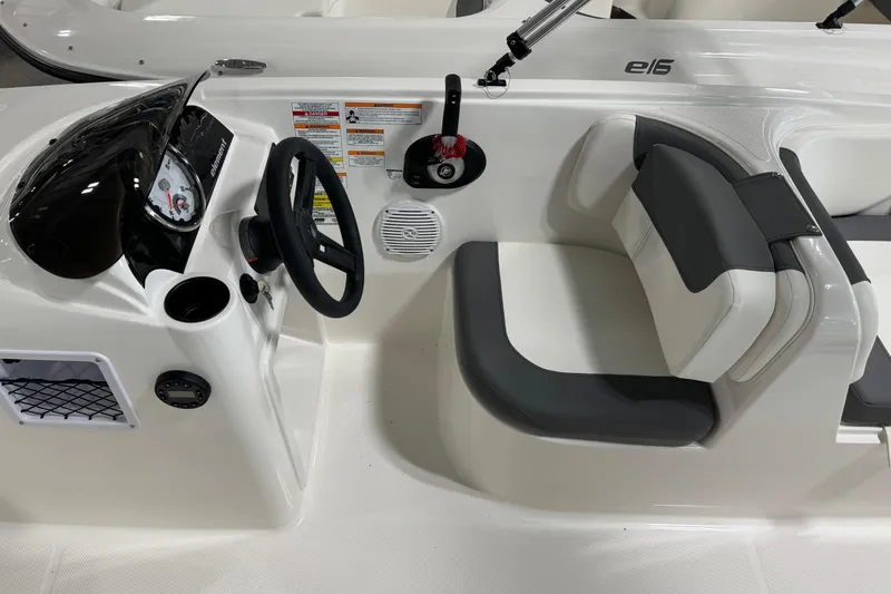 Slide: The Image of 2026 Bayliner Element E18 boat interior with steering wheel and seating area. - 6