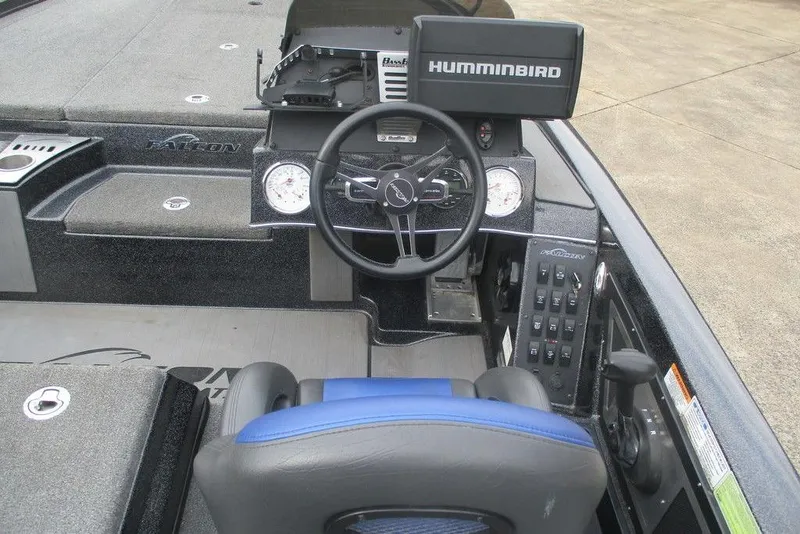 Slide: The Image of Cockpit of a 2021 Falcon F21 boat with Humminbird electronics and steering wheel. - 4