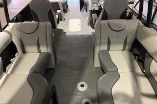 Slide: The Image of Interior of 2025 Godfrey Monaco 235 SD boat with modern seating design. - 12