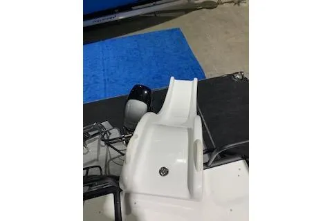 Slide: The Image of 2025 Godfrey Monaco 235 SD boat with sleek white slide and modern design. - 4