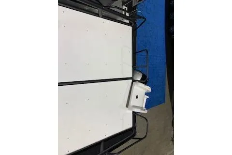 Slide: The Image of 2025 Godfrey Monaco 235 SD boat deck with seating and railing. - 5