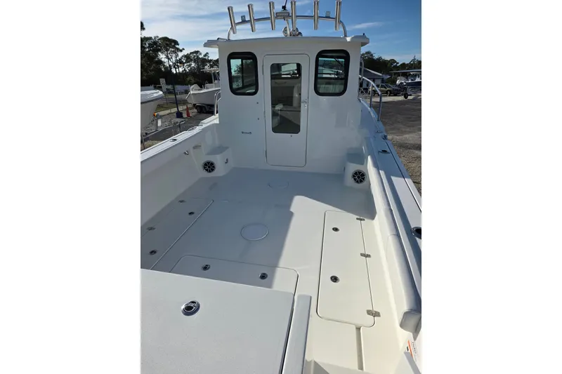 Slide: The Image of 2026 Parker 247 Explorer boat deck with spacious seating and storage compartments. - 17