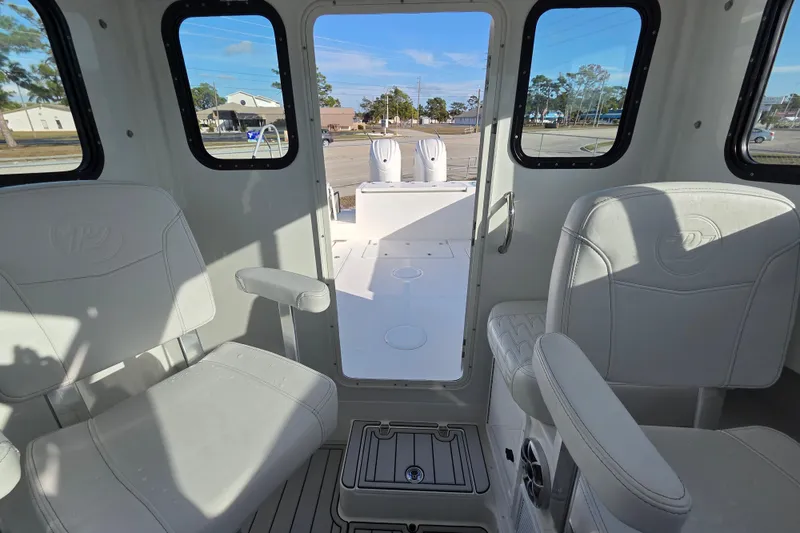 Slide: The Image of Interior view of 2026 Parker 247 Explorer boat with seating and windows. - 20