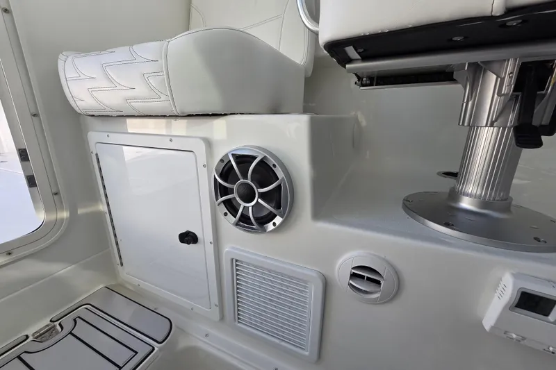 Slide: The Image of Interior of 2026 Parker 247 Explorer boat with seating and speaker system. - 23