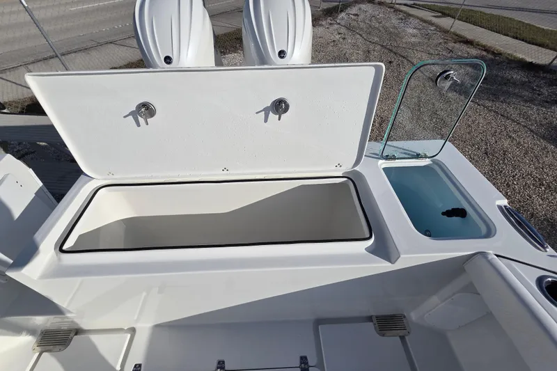 Slide: The Image of 2026 Parker 247 Explorer boat storage compartments and seating area. - 27