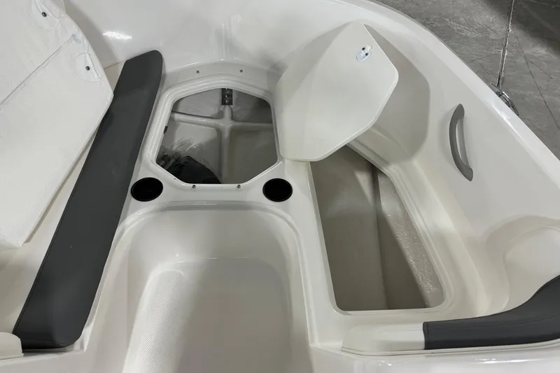 Slide: The Image of 2026 Bayliner Element E18 boat interior with storage compartments and seating. - 9