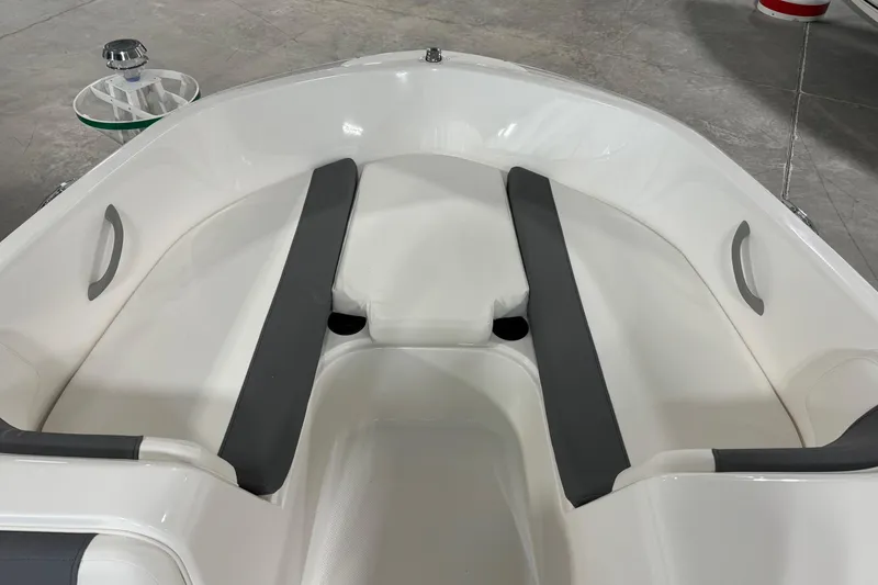 Slide: The Image of 2026 Bayliner Element E18 boat interior with gray seating and white hull. - 10