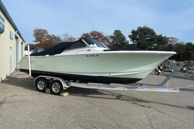 The Image of 2016 Seahunt 235 Escape DC boat on trailer, parked outdoors. - 0