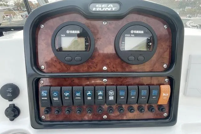 Slide: The Image of Control panel of 2016 Seahunt 235 Escape DC boat with Yamaha gauges and switches. - 13