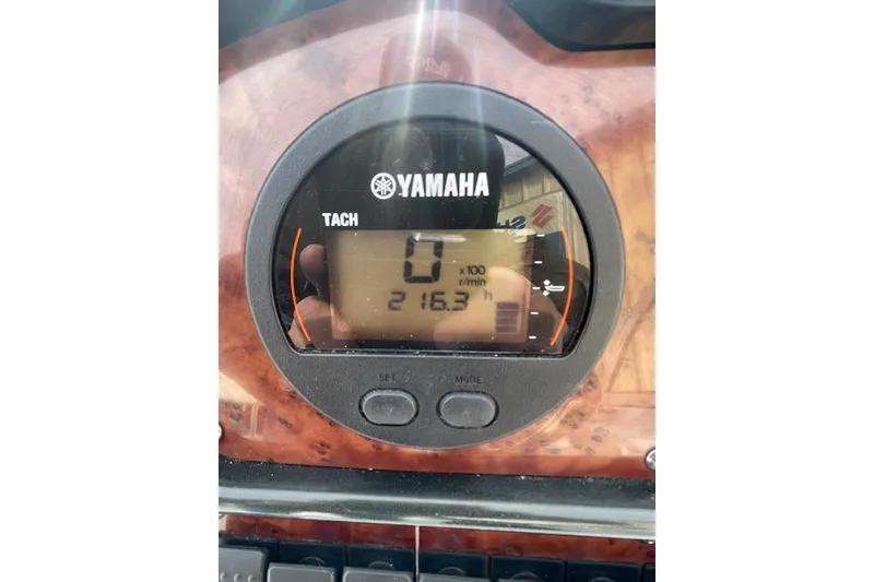 Slide: The Image of Yamaha tachometer on 2016 Seahunt 235 Escape DC boat dashboard, showing 216.3 hours. - 14