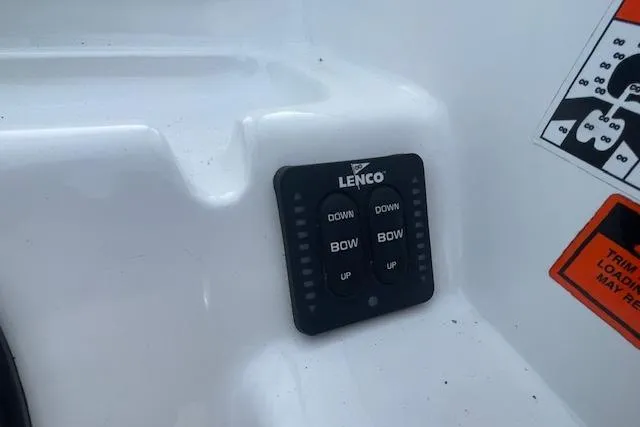Slide: The Image of Lenco trim tab control on 2016 Seahunt 235 Escape DC boat dashboard. - 16