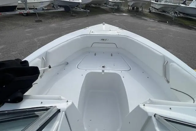 Slide: The Image of 2016 Seahunt 235 Escape DC boat interior, spacious seating, and storage area. - 21