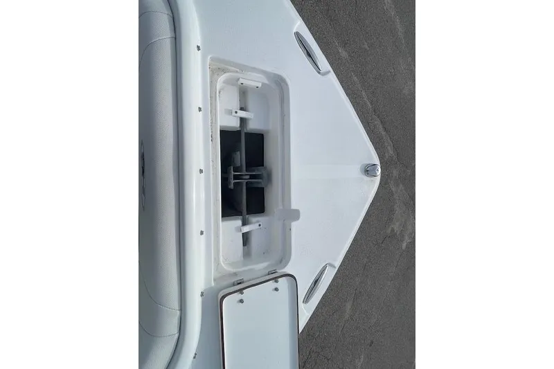 Slide: The Image of 2016 Seahunt 235 Escape DC boat anchor compartment, open view. - 24