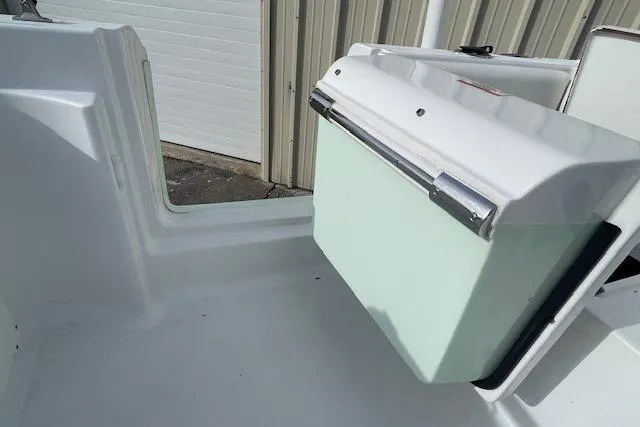 Slide: The Image of 2016 Seahunt 235 Escape DC boat interior with storage compartment. - 29