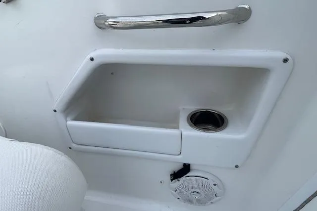 Slide: The Image of Interior detail of 2016 Seahunt 235 Escape DC boat with storage and cup holder. - 38