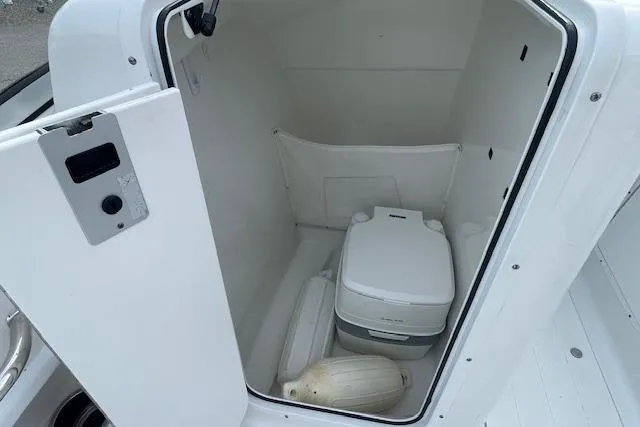 Slide: The Image of Portable toilet inside 2016 Seahunt 235 Escape DC boat compartment. - 39
