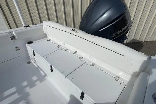 Slide: The Image of 2016 Seahunt 235 Escape DC boat with Yamaha engine, featuring spacious seating and storage. - 9