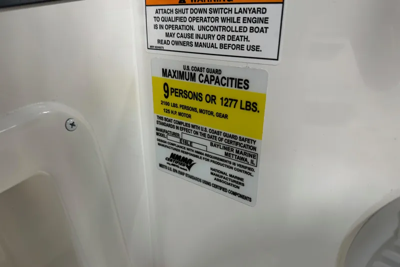 Slide: The Image of 2025 Bayliner Element E18 capacity label, max 9 persons or 1277 lbs, 125 HP motor. - 16