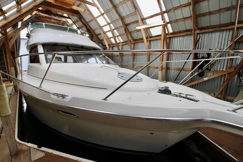 Slide: The Image of 1998 Bayliner 3788 Command Bridge Motoryacht in a wooden boathouse. - 10