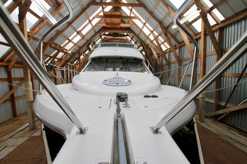 Slide: The Image of 1998 Bayliner 3788 Command Bridge Motoryacht in a wooden boathouse. - 11