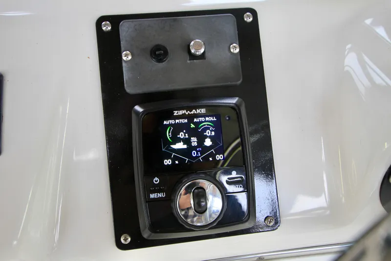 Slide: The Image of 1998 Bayliner 3788 Command Bridge Motoryacht with dinghy and American flag. - 18