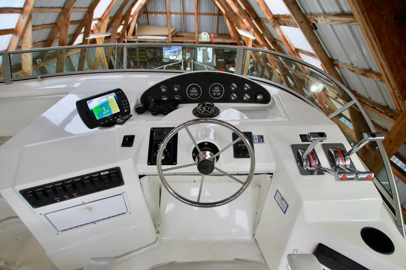 Slide: The Image of Storage compartment of a 1998 Bayliner 3788 Command Bridge Motoryacht with various equipment and "No Step" sign. - 20