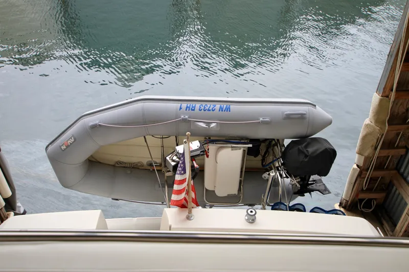 Slide: The Image of 1998 Bayliner 3788 Command Bridge Motoryacht helm with steering wheel and navigation controls. - 22