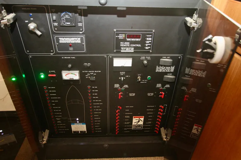 Slide: The Image of 1998 Bayliner 3788 Command Bridge Motoryacht interior with white seating and control panel. - 30