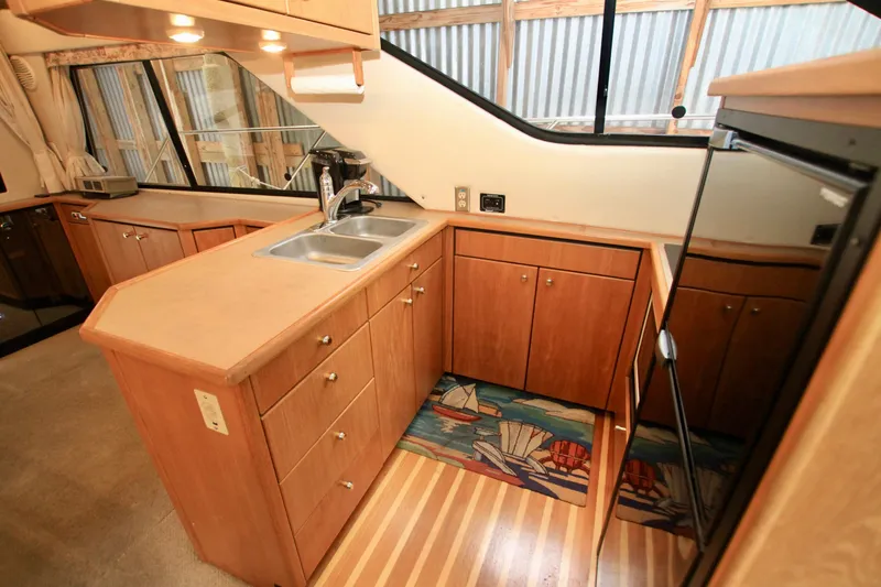 Slide: The Image of Electrical control panel of 1998 Bayliner 3788 Command Bridge Motoryacht with various switches and indicators. - 35