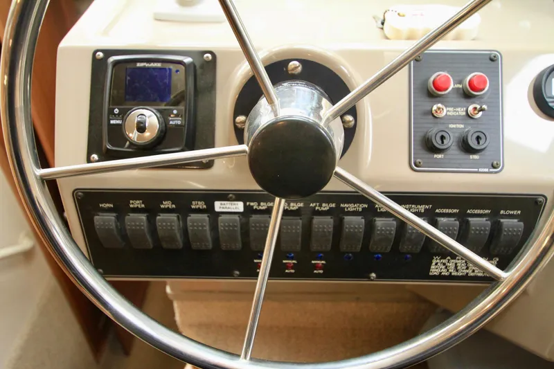 Slide: The Image of 1998 Bayliner 3788 Command Bridge Motoryacht kitchen with wood cabinets and dual sink. - 40