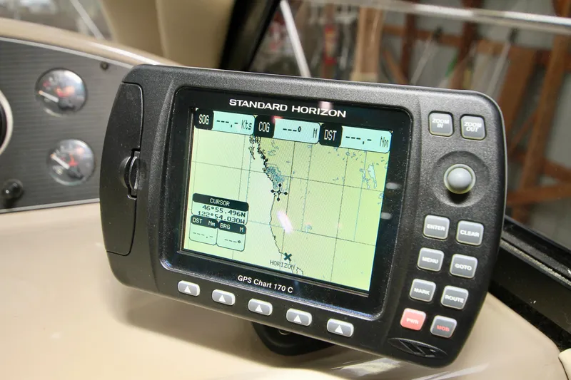 Slide: The Image of Carpeted interior of 1998 Bayliner 3788 Command Bridge Motoryacht with vent and wood paneling. - 44